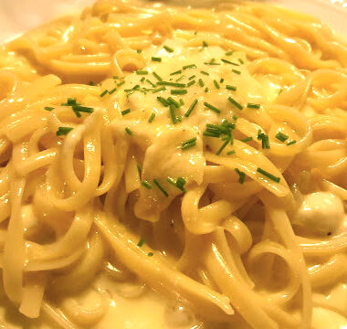 photo of creamy alfredo sauce with pasta